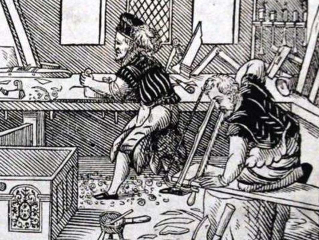 Woodcut of people working in an early modern shop